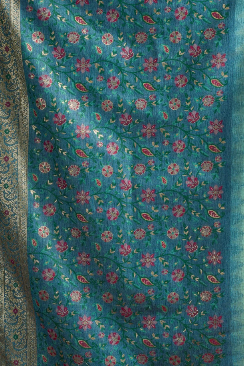 Floral patterned fabric with pink flowers on a blue background