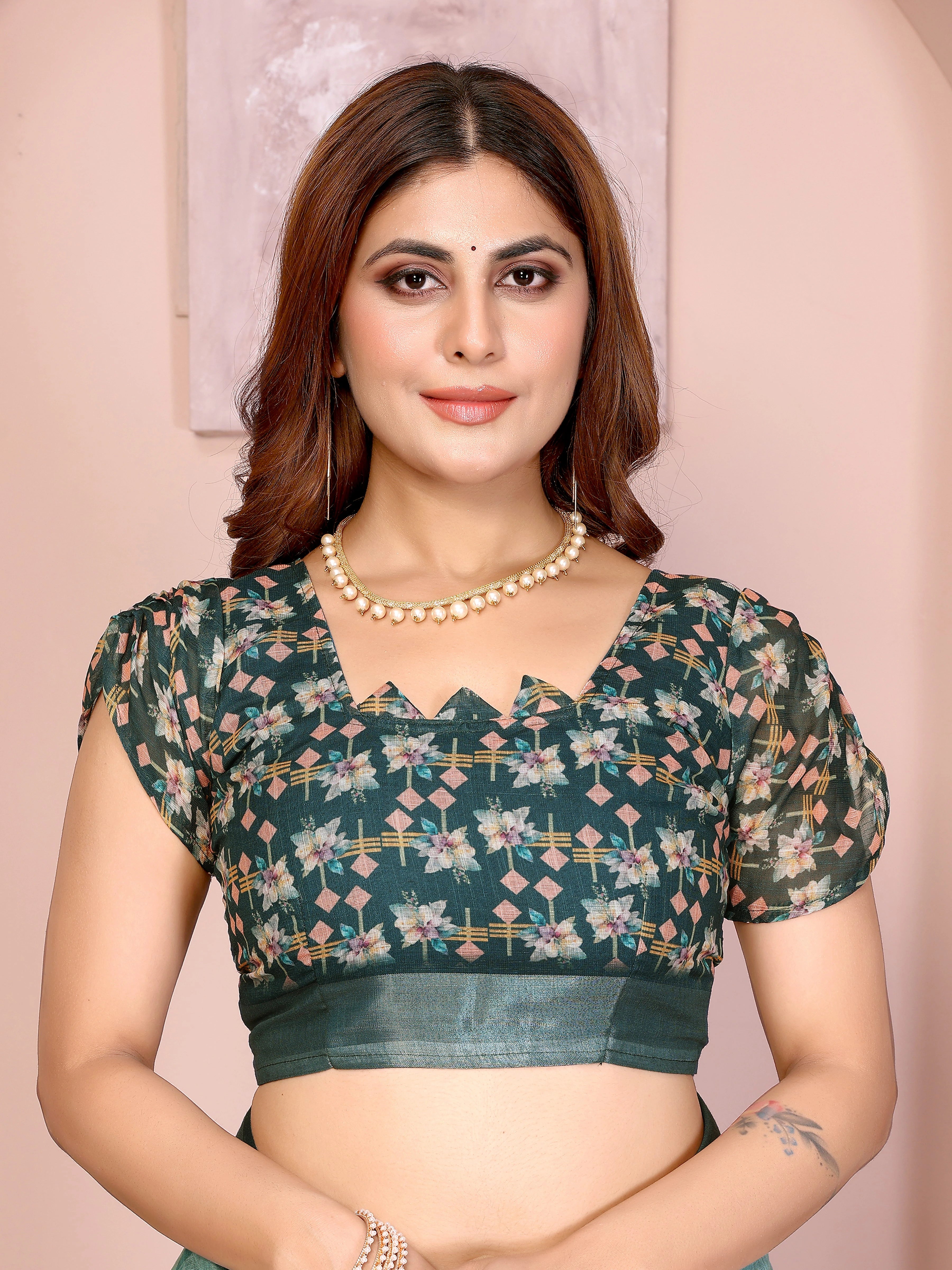 Blouse piece close-up of Tropical Green Digital Floral Print Saree showing dark teal printed running blouse with puff sleeves