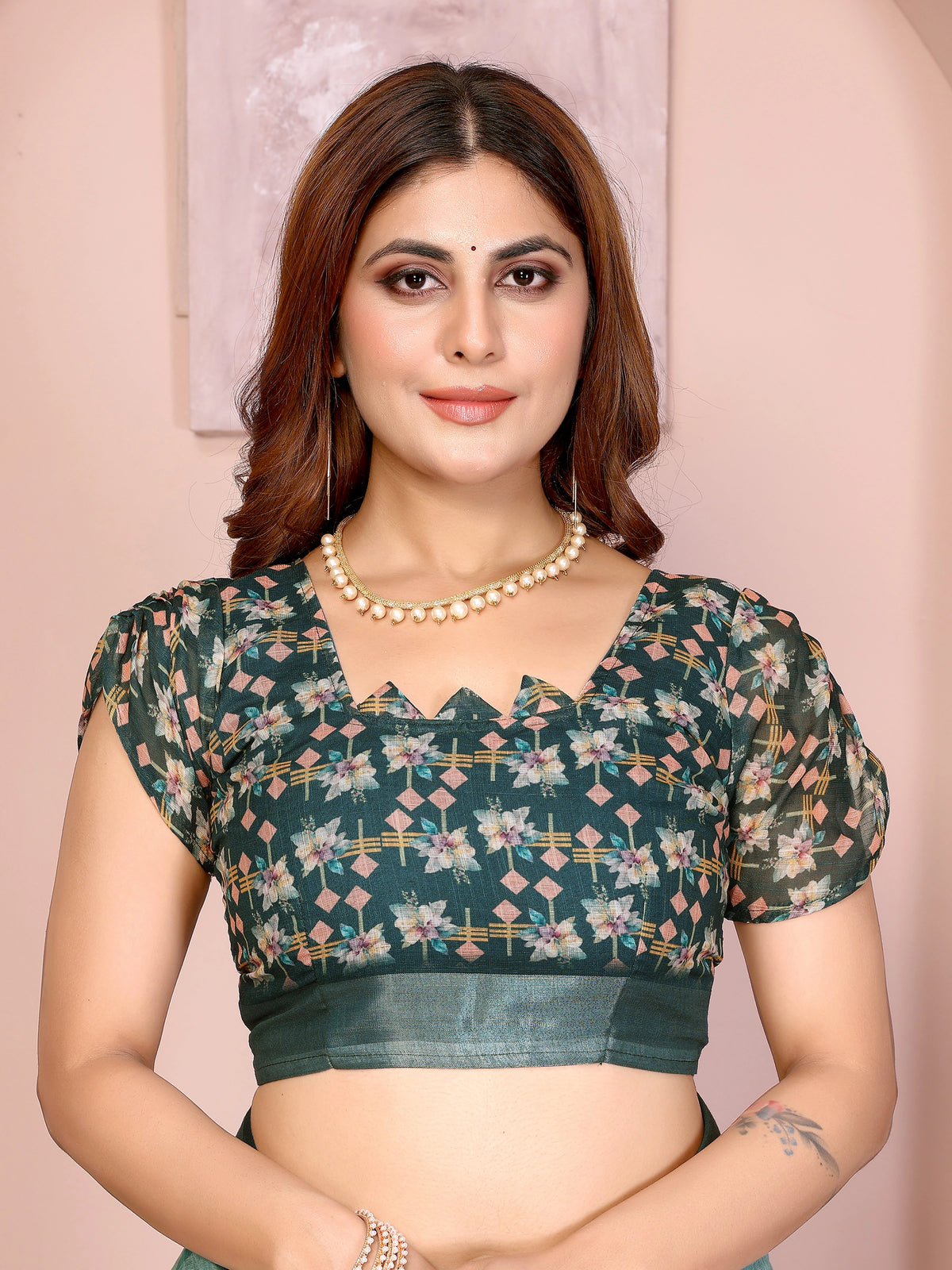 Blouse piece close-up of Tropical Green Digital Floral Print Saree showing dark teal printed running blouse with puff sleeves
