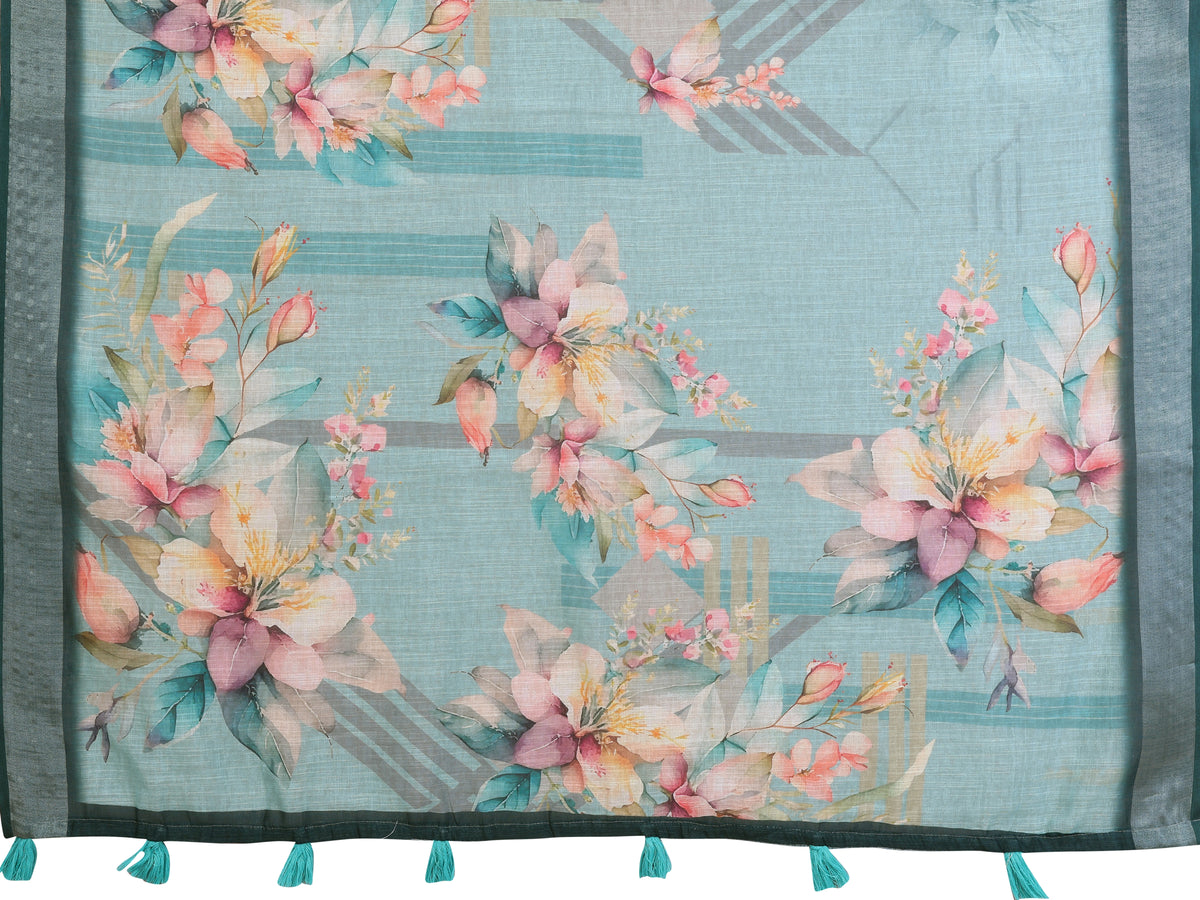 Flat lay of Tropical Green Digital Floral Print Linen Cotton Saree showing full fabric with botanical florals and contrast border with teal tassels