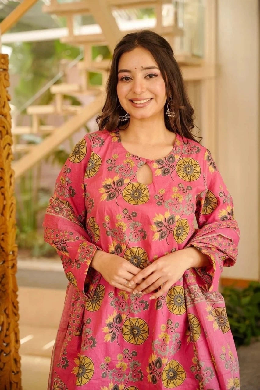 Woman wearing a pink floral dress indoors