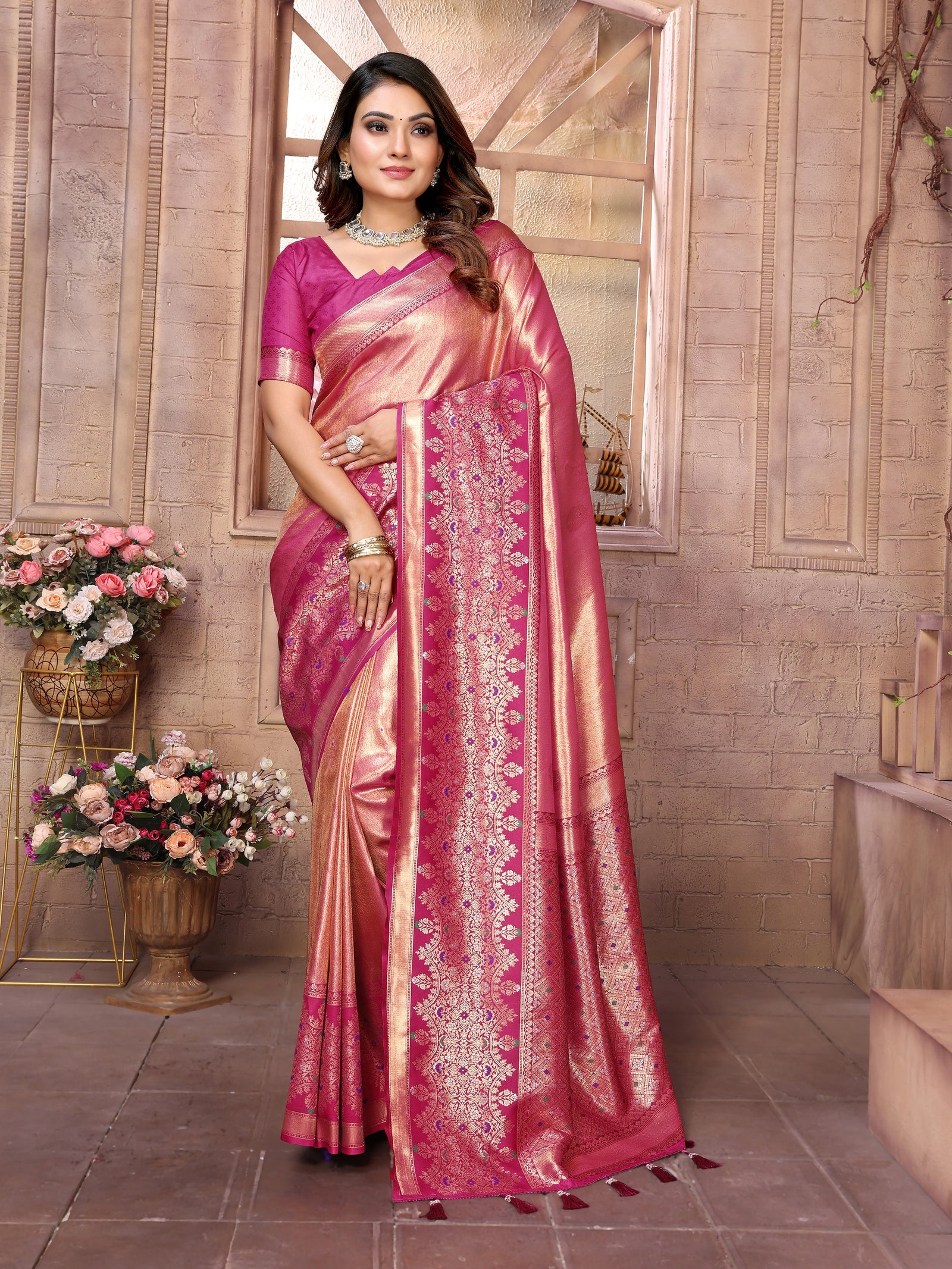 The pure silk fabric showcases intricate zari work that catches light beautifully, while the hand-woven Banarasi border adds authentic heritage appeal.
