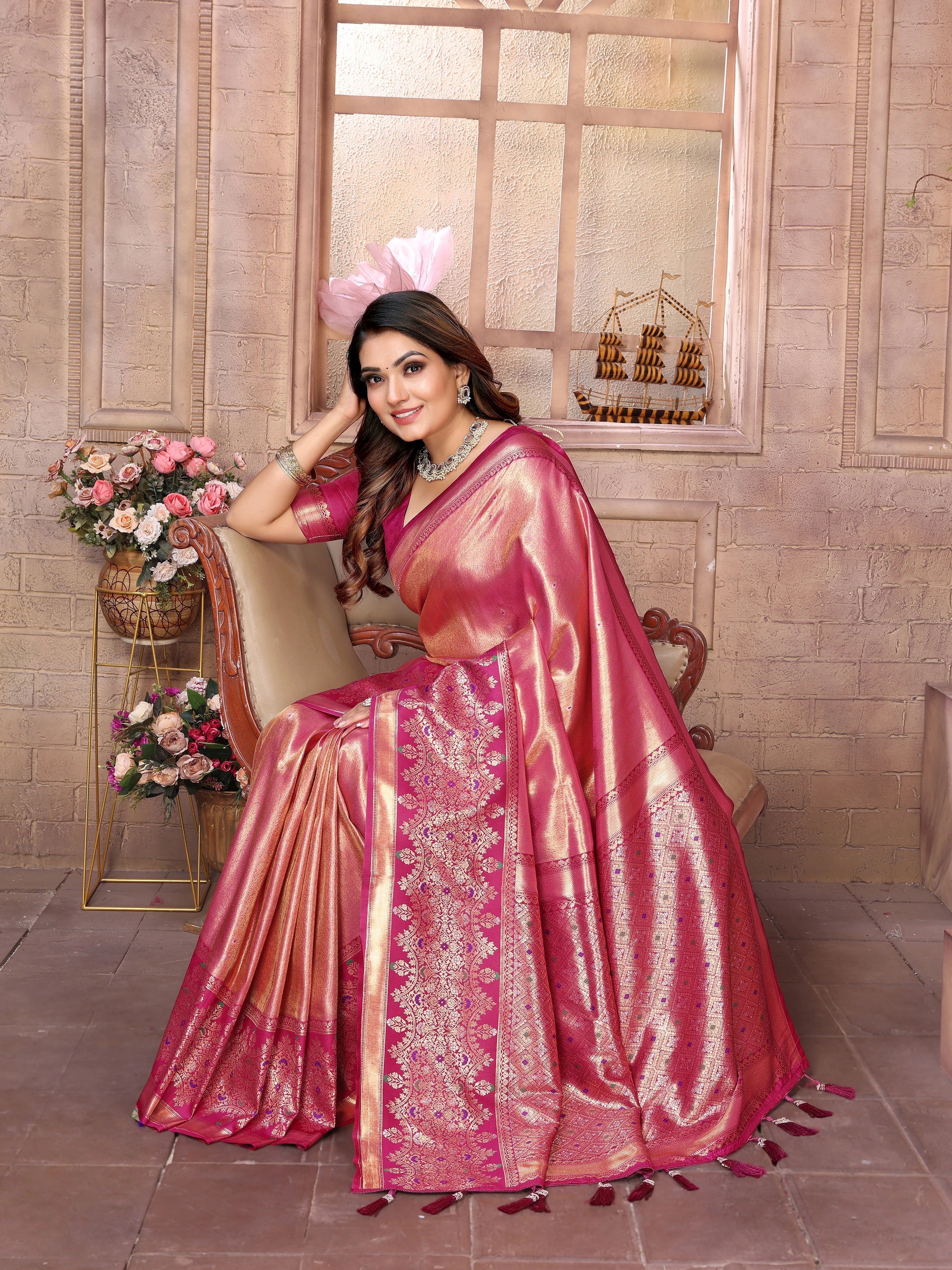 Elevate your ethnic wardrobe with this exquisite Tulip Pink Banarasi Tissue Silk saree, a timeless piece that celebrates heritage craftsmanship. Woven with intricate zari detailing, this saree showcases the signature elegance of pure Banarasi silk in a delicate tissue weave that drapes beautifully.