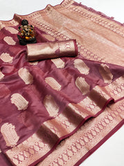 Maroon and beige saree with a decorative item on a white background