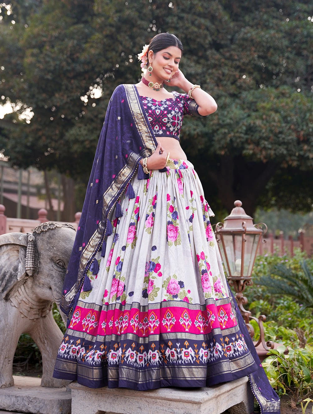 Woman in a traditional outfit with floral patterns outdoors