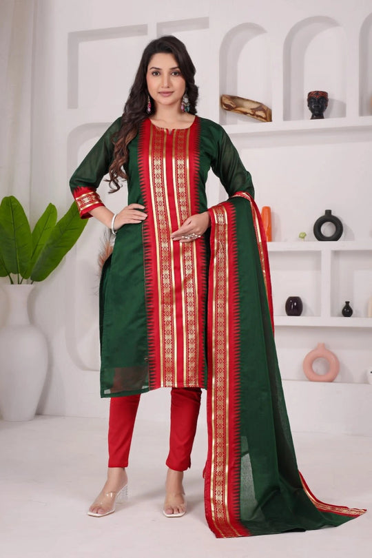 Woman wearing a green and red traditional outfit with a white background