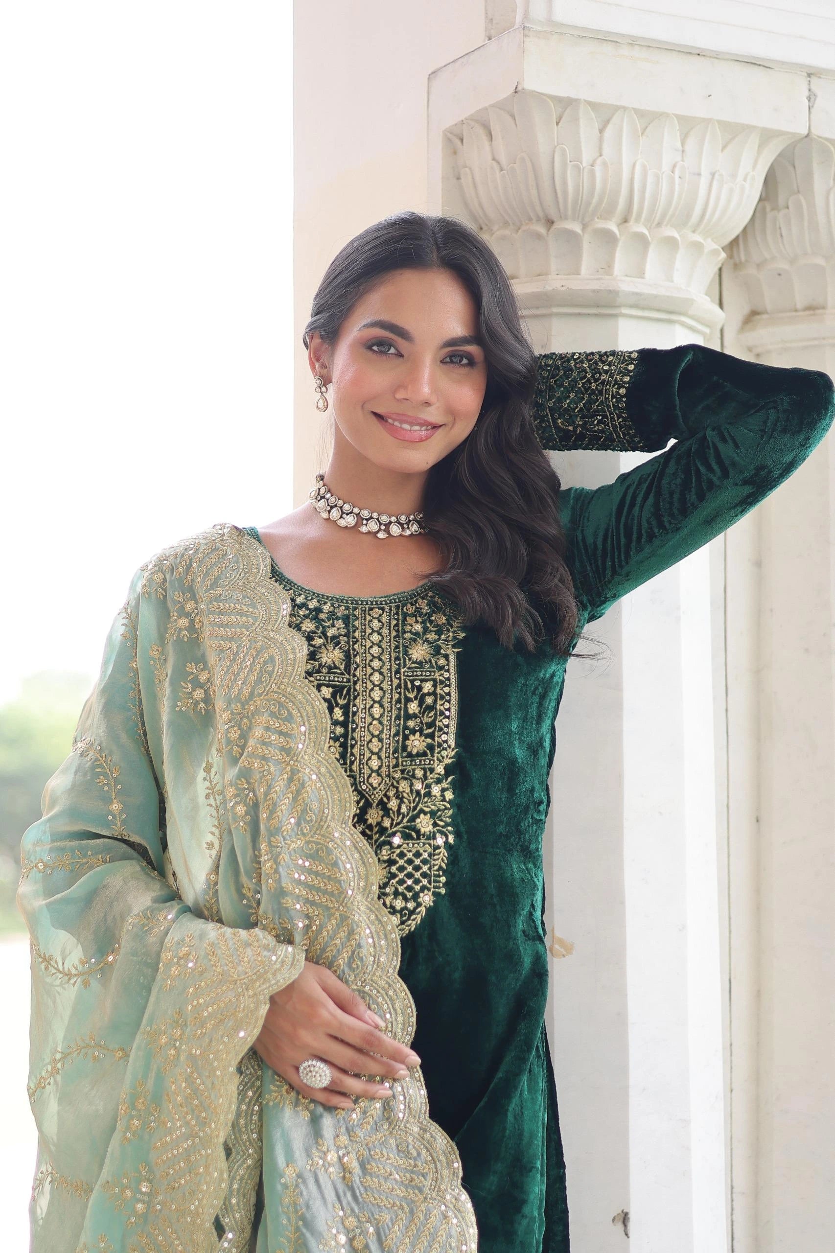 Sophisticated blue kurta with heavy embroidered panel, paired with matching trousers and a delicately embellished dupatta.
