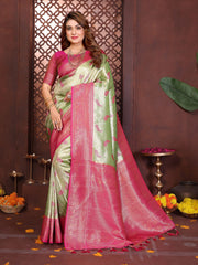 Woman wearing a pink and green saree with a decorative background