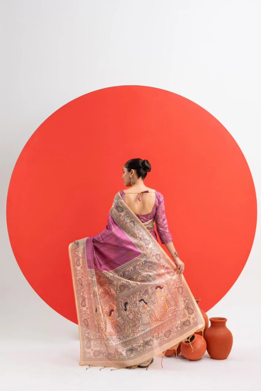 Woman in a traditional saree standing in front of a large red circle on a white background