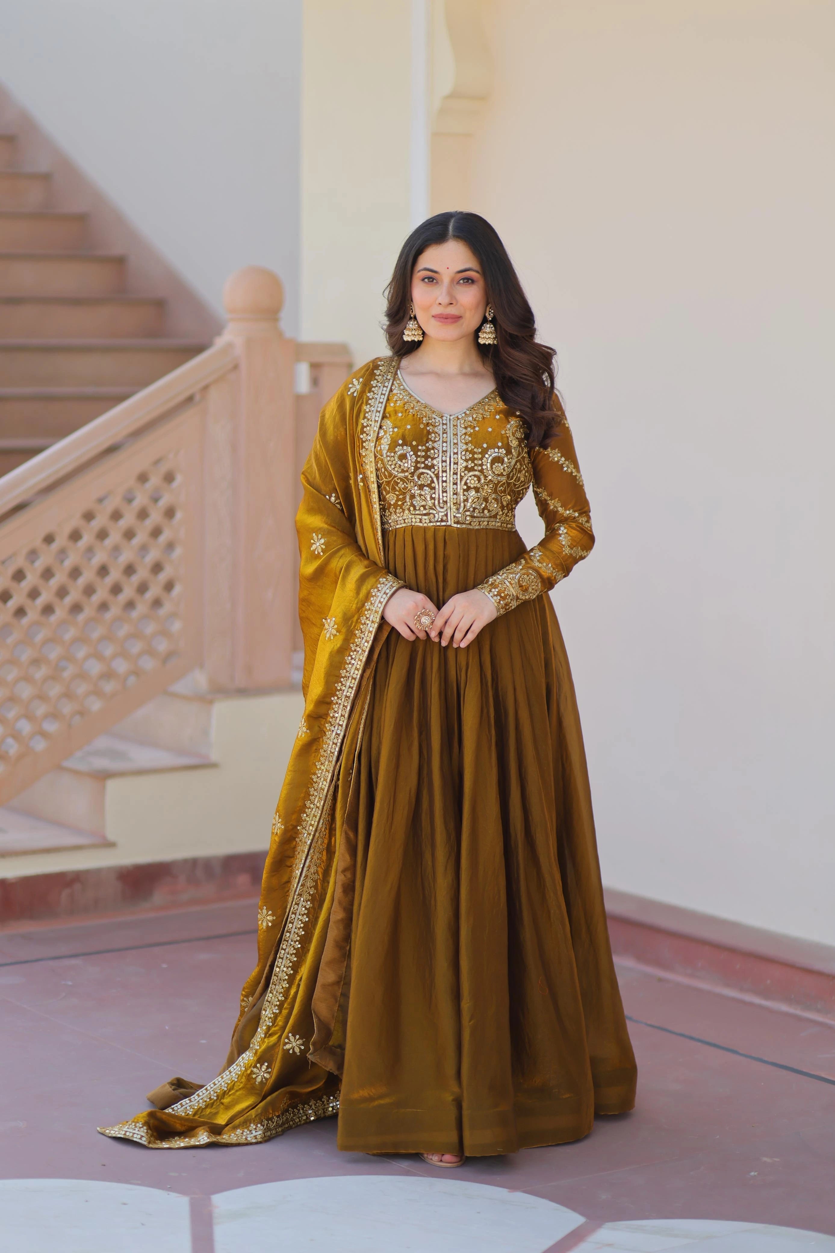 Fendy fabric Anarkali gown with intricate zari and sequins embroidery