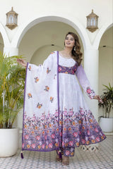 Graceful ethnic wear featuring a white and lavender floral Anarkali, printed pants, and a lightweight dupatta for festive occasions.