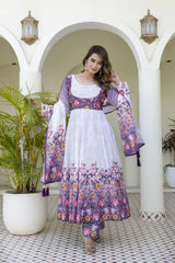 Sophisticated lavender floral ethnic outfit combining a flared Anarkali kurta, printed bottoms, and a graceful sheer dupatta with tassels.