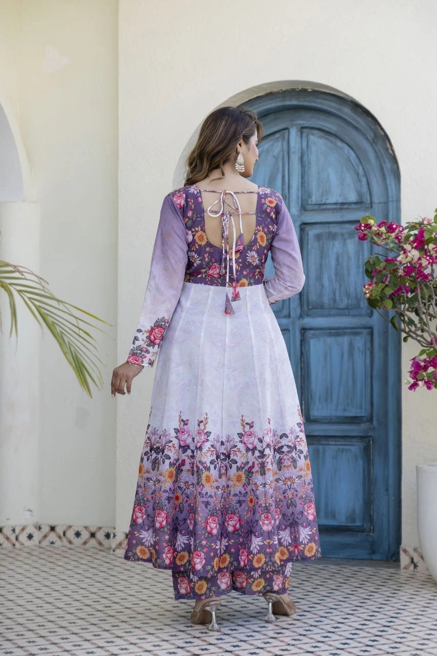 Beautiful ethnic ensemble featuring a floral printed Anarkali kurta, matching pants, and a sheer dupatta with floral borders.