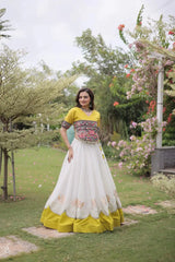 Elegant Ivory White Party Wear Lehenga featuring Designer Embroidered Blouse, Mustard Yellow Border, and Ethnic Charm