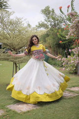 Stunning Ivory White and Mustard Yellow Lehenga Choli with Vibrant Kutchi Embroidery, Flowing Flared Skirt, and Festive Traditional Appeal