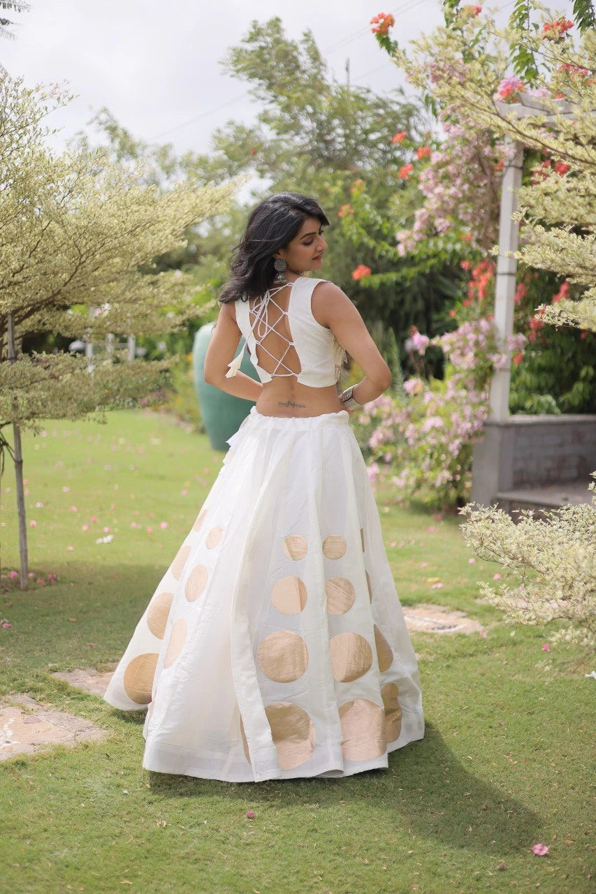Premium white party wear lehenga designed with luxurious detailing and elegant traditional craftsmanship.