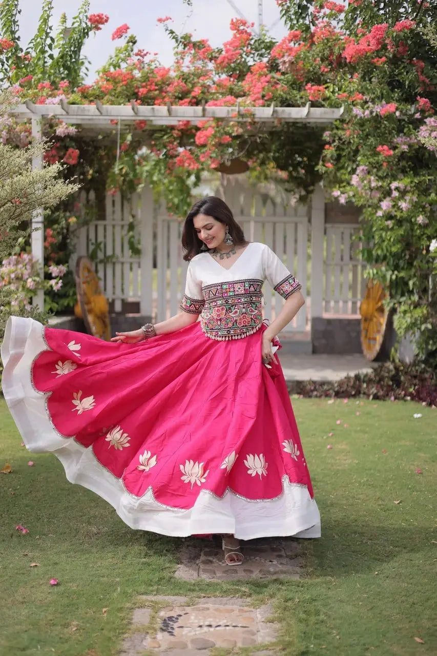 Stunning White and Hot Pink Lehenga Choli with Vibrant Kutchi Embroidery, Flowing Flared Skirt, and Festive Traditional Appeal
