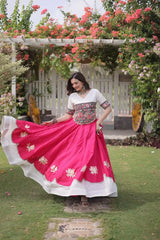 Stunning White and Hot Pink Lehenga Choli with Vibrant Kutchi Embroidery, Flowing Flared Skirt, and Festive Traditional Appeal