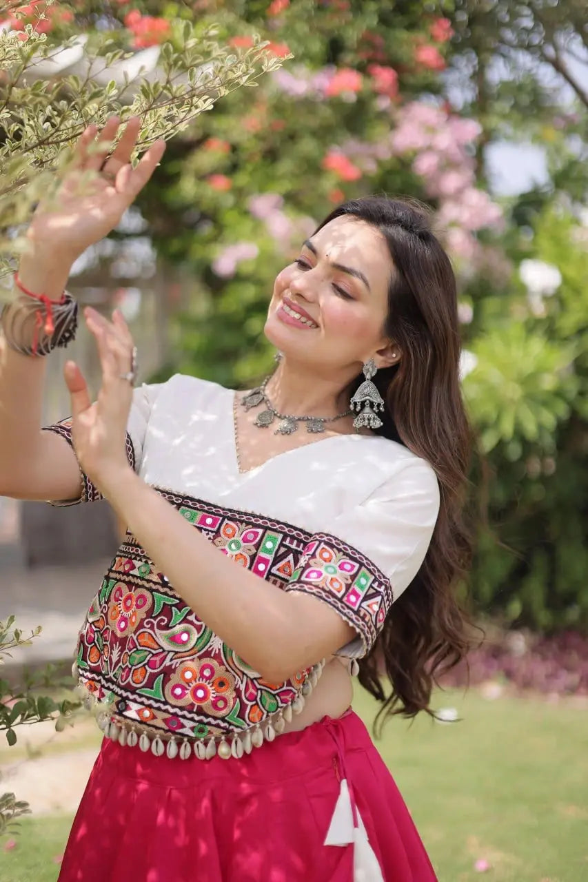 Designer Hot Pink Lehenga Set featuring White Embroidered Blouse, Multicolor Artisan Motifs, and Contrast Border