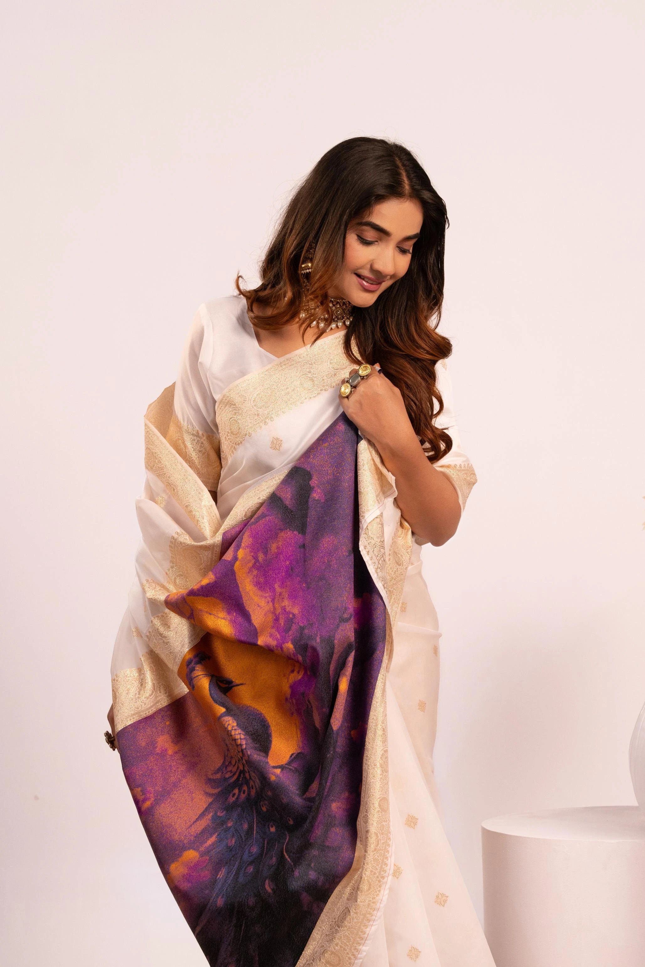 Woman wearing a colorful scarf with abstract patterns on a white background