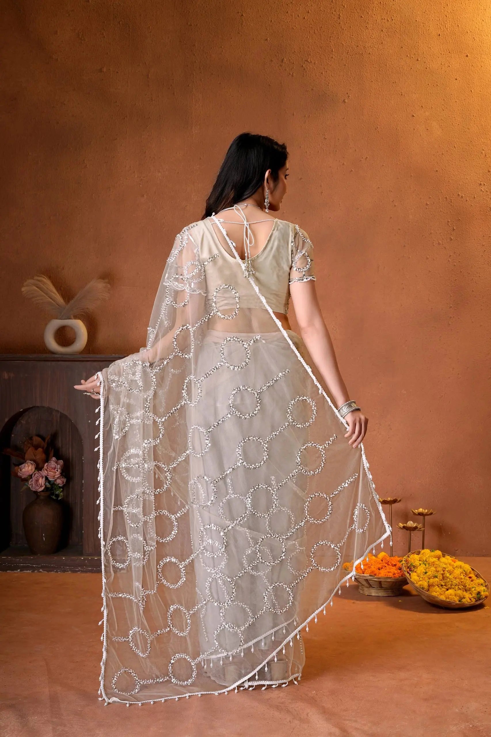 Beautiful Indian saree showcasing all-over sequins work, delicate bead detailing, and timeless traditional craftsmanship.