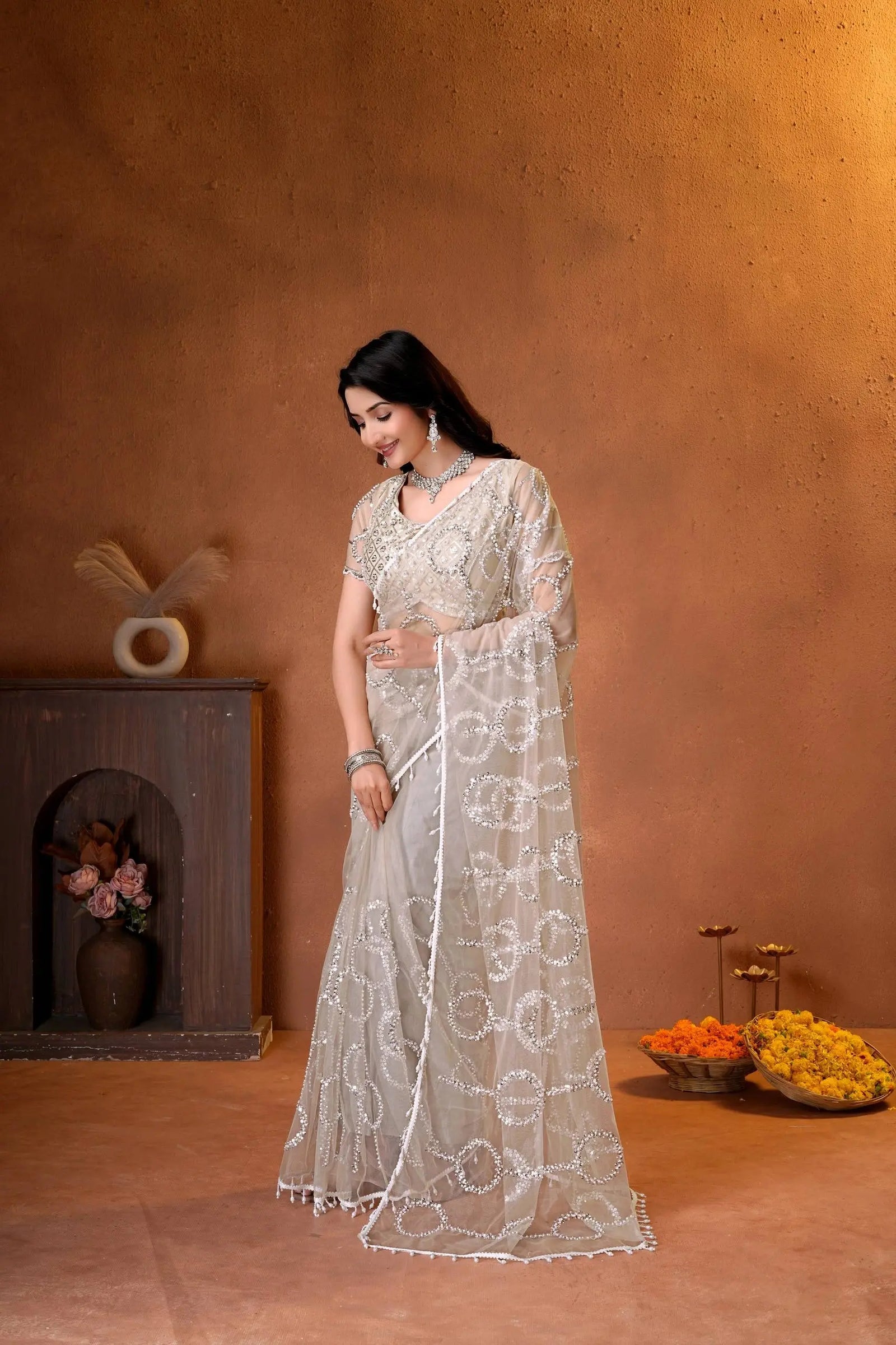 Premium party wear saree with a matching embroidered blouse, sheer embellished pallu, and luxurious ethnic styling.