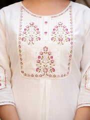 Close-up of a white kurta with floral embroidery on a plain background