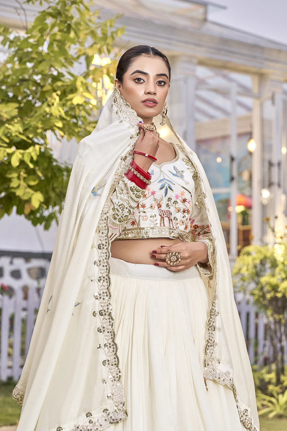 Woman in traditional outfit with floral patterns outdoors