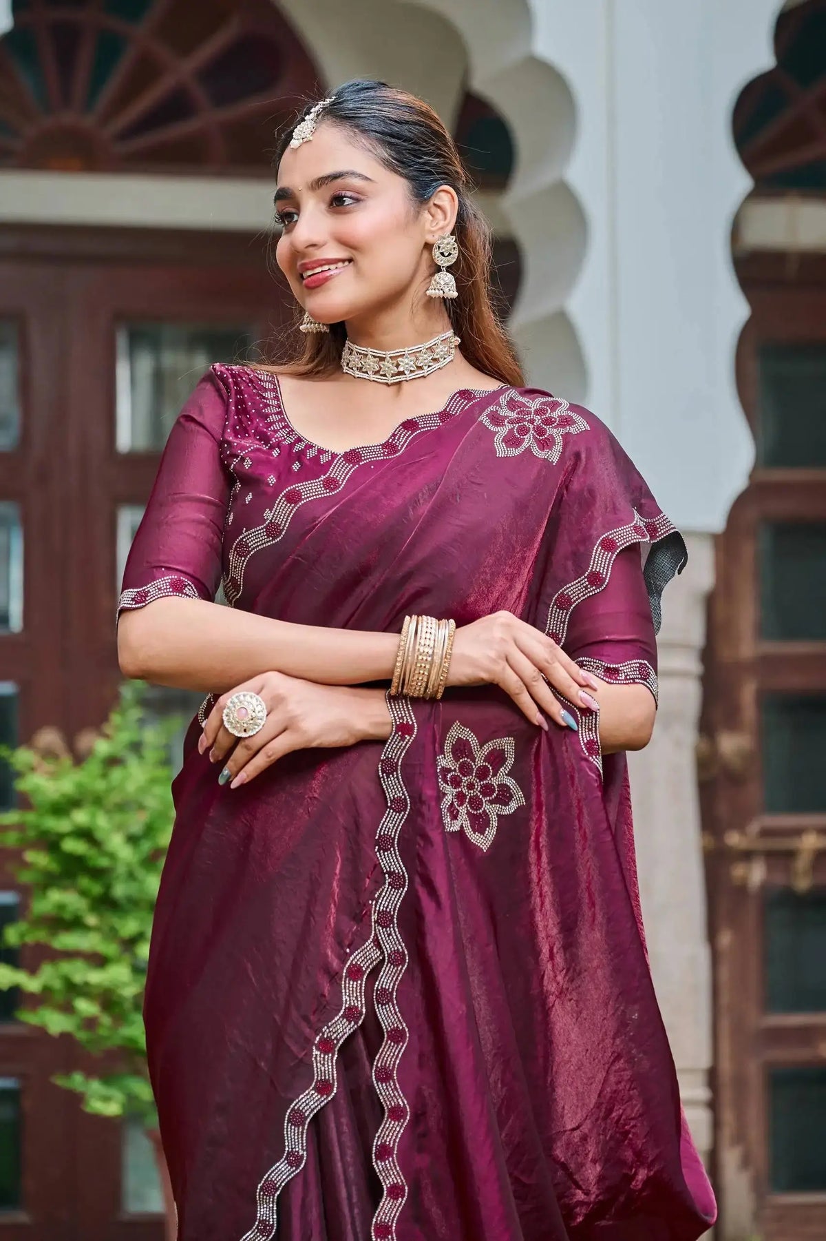 Close-up of Wine Diamond Work Saree blouse and pallu with floral stone motif