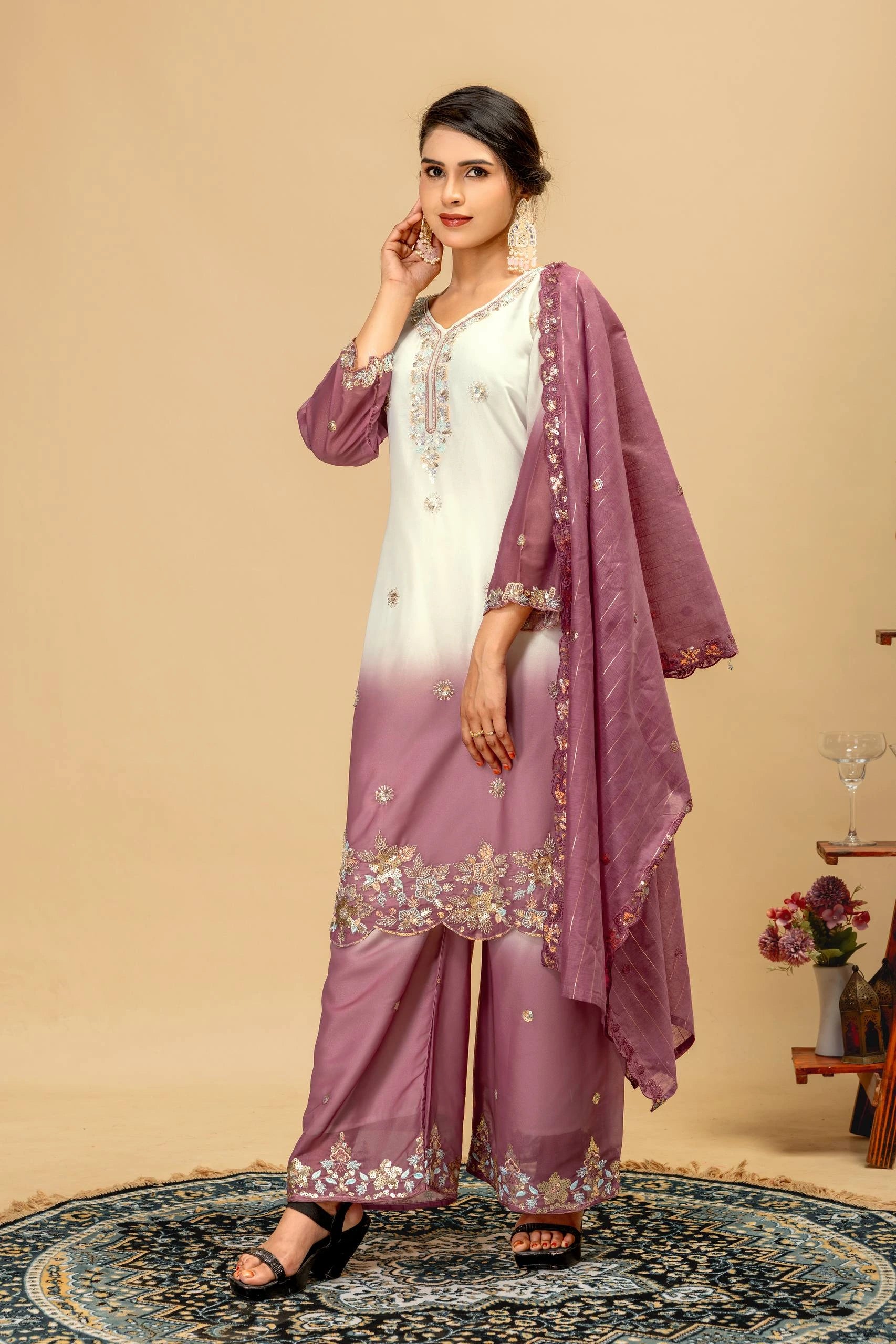 Woman wearing a white and purple traditional outfit with a beige background