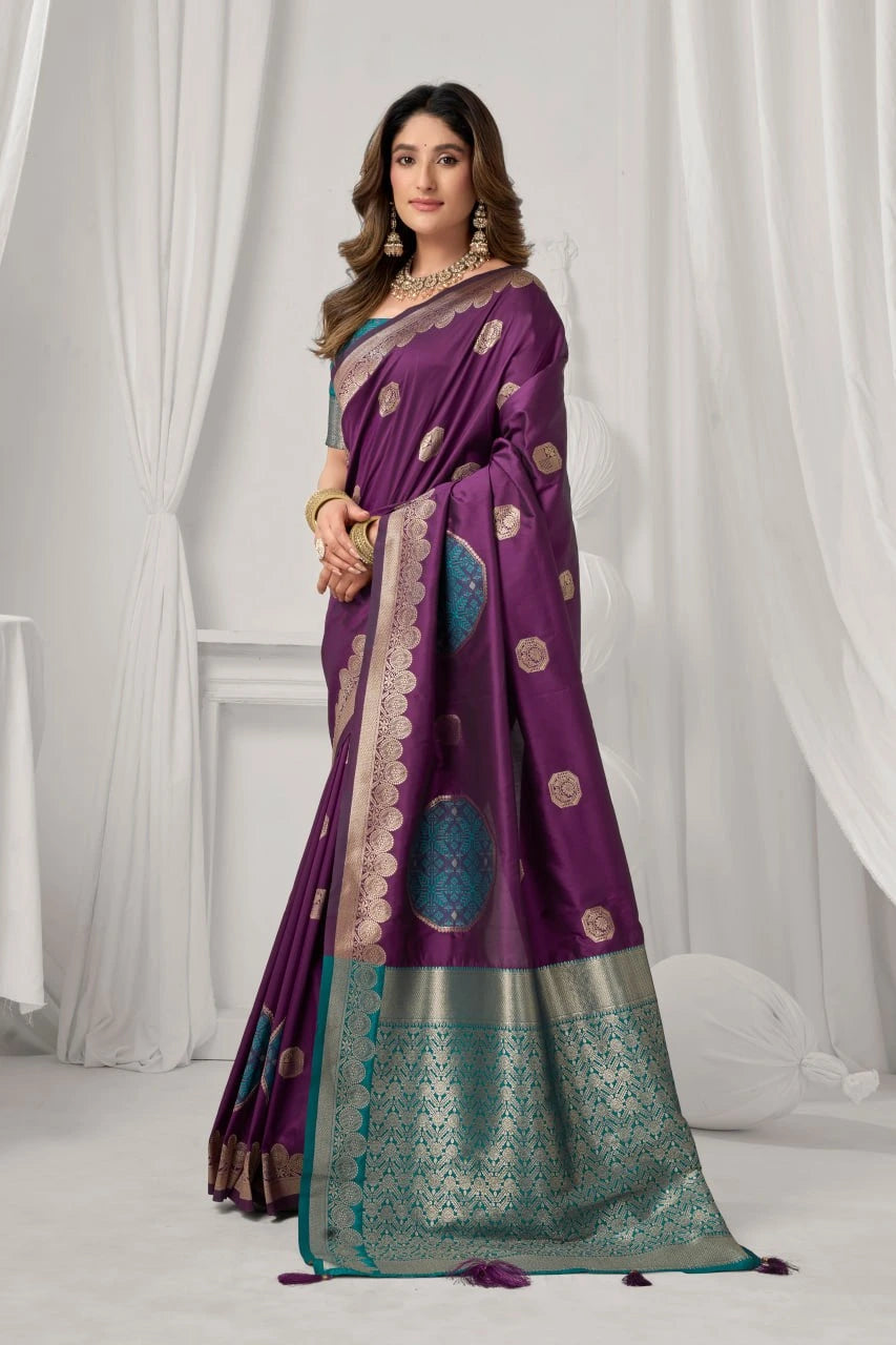 Woman wearing a purple saree with a white background