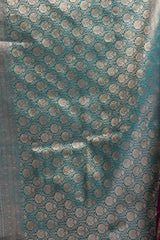 Teal fabric with silver circular patterns