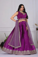 Woman wearing a purple traditional outfit with a white background