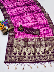 Pink and purple saree with elephant patterns on a white background