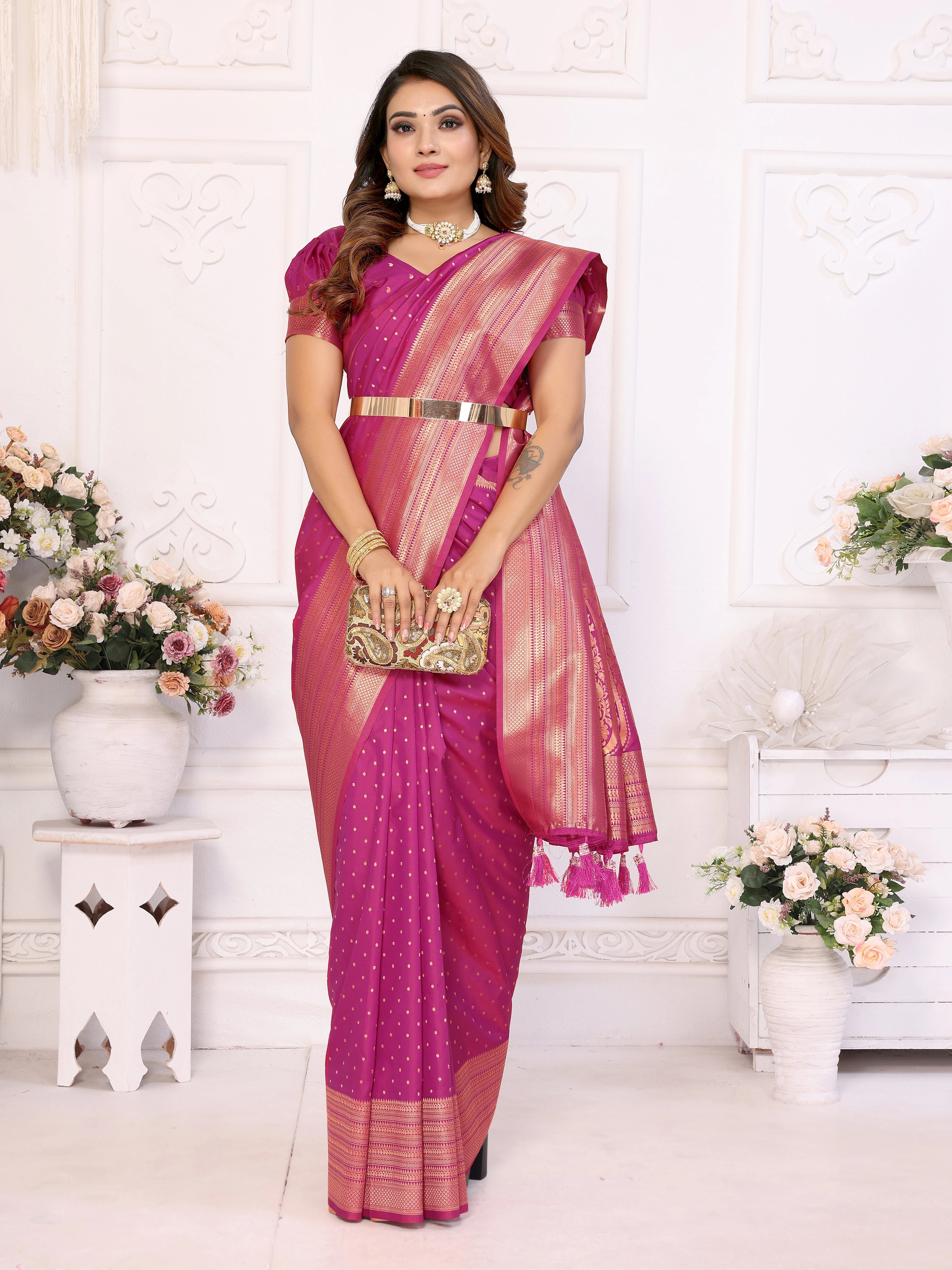 Woman in a pink saree with a white background