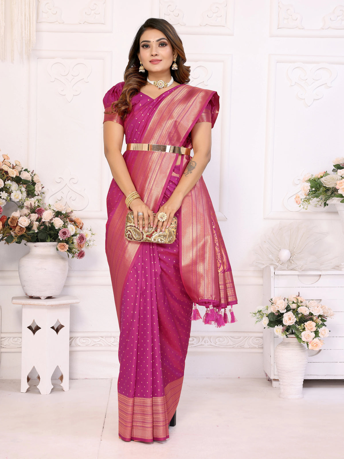 Woman in a pink saree with a white background