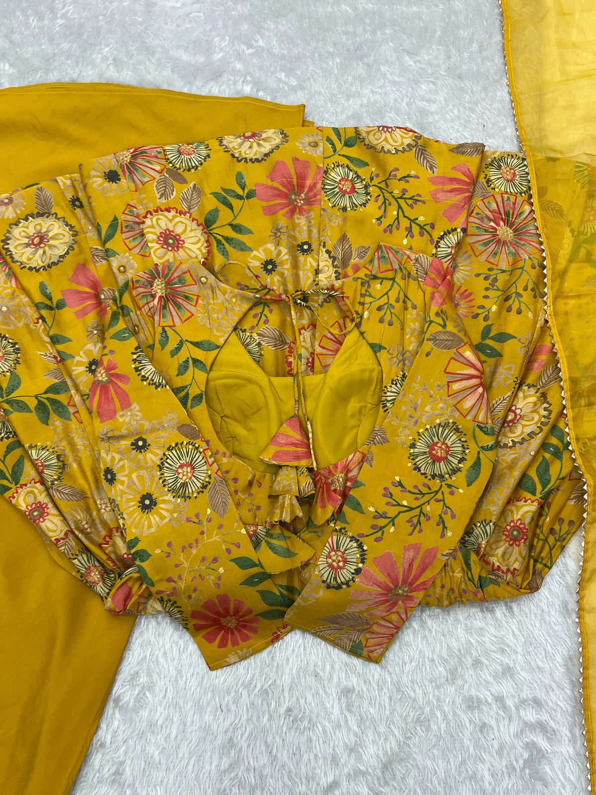 Yellow Discharge Print Suit flat lay showing keyhole back detail