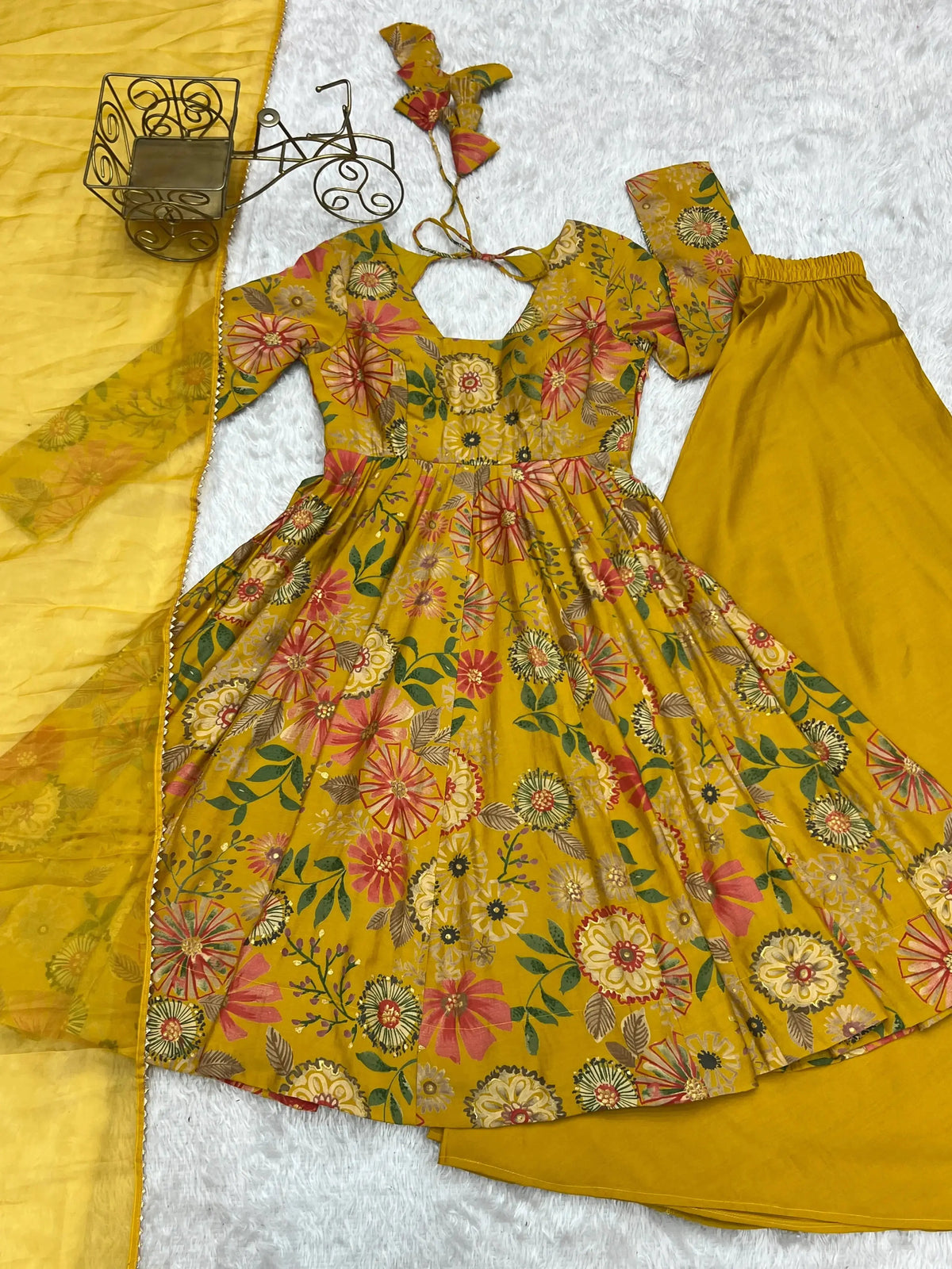 Yellow Discharge Print Suit flat lay showing kurta, palazzo and dupatta set