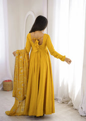 Back view of Yellow Sequins Embroidered Anarkali Suit showing fancy ruffle back with dori tie