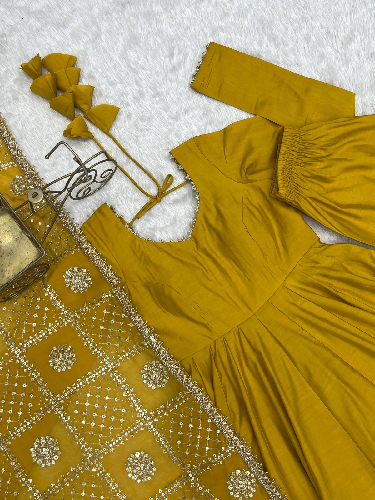Flat lay close-up of Yellow Anarkali Suit neck and sequins embroidered dupatta
