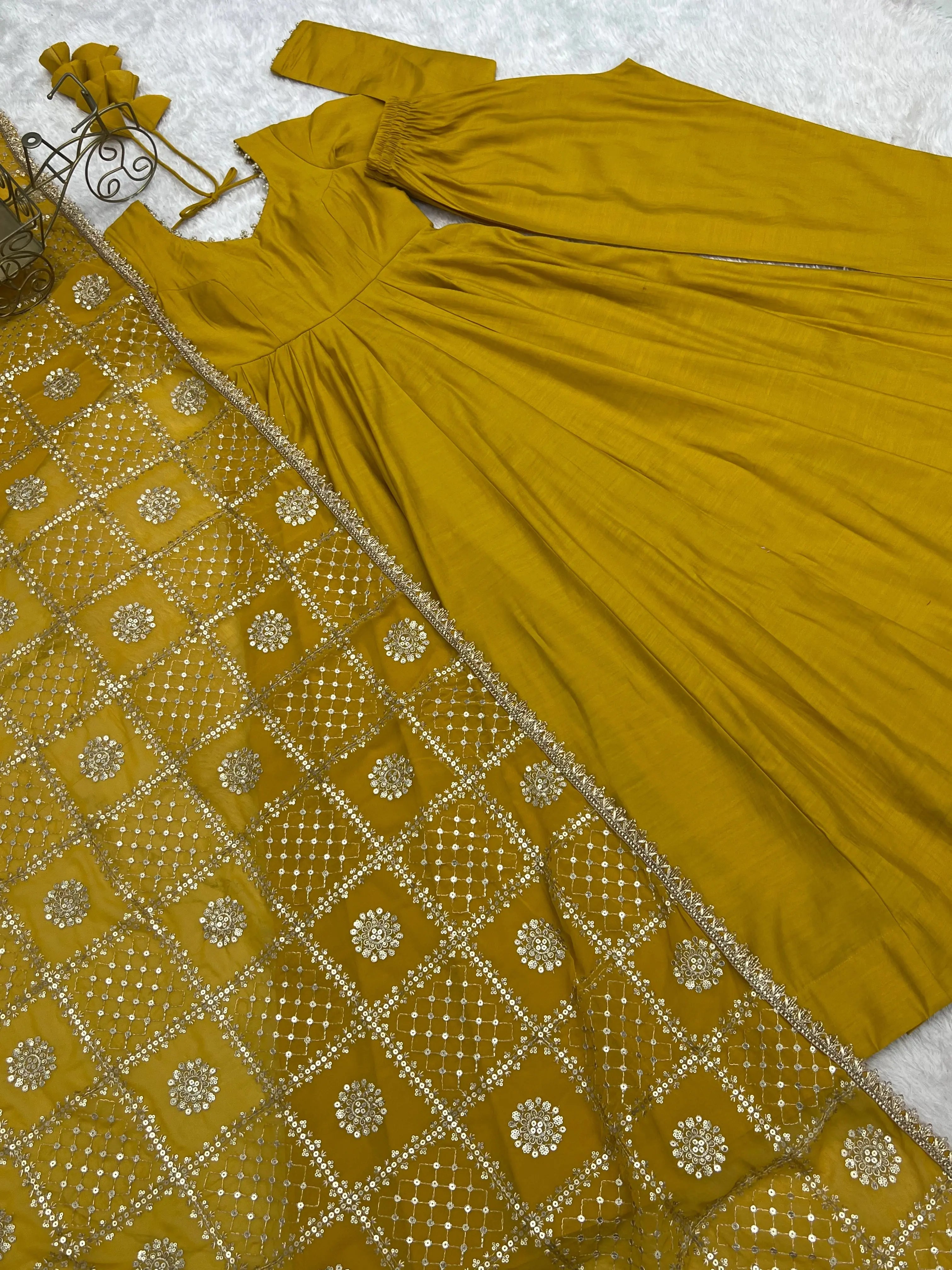 Flat lay of Yellow Sequins Embroidered dupatta showing gold sequins and zari medallion work