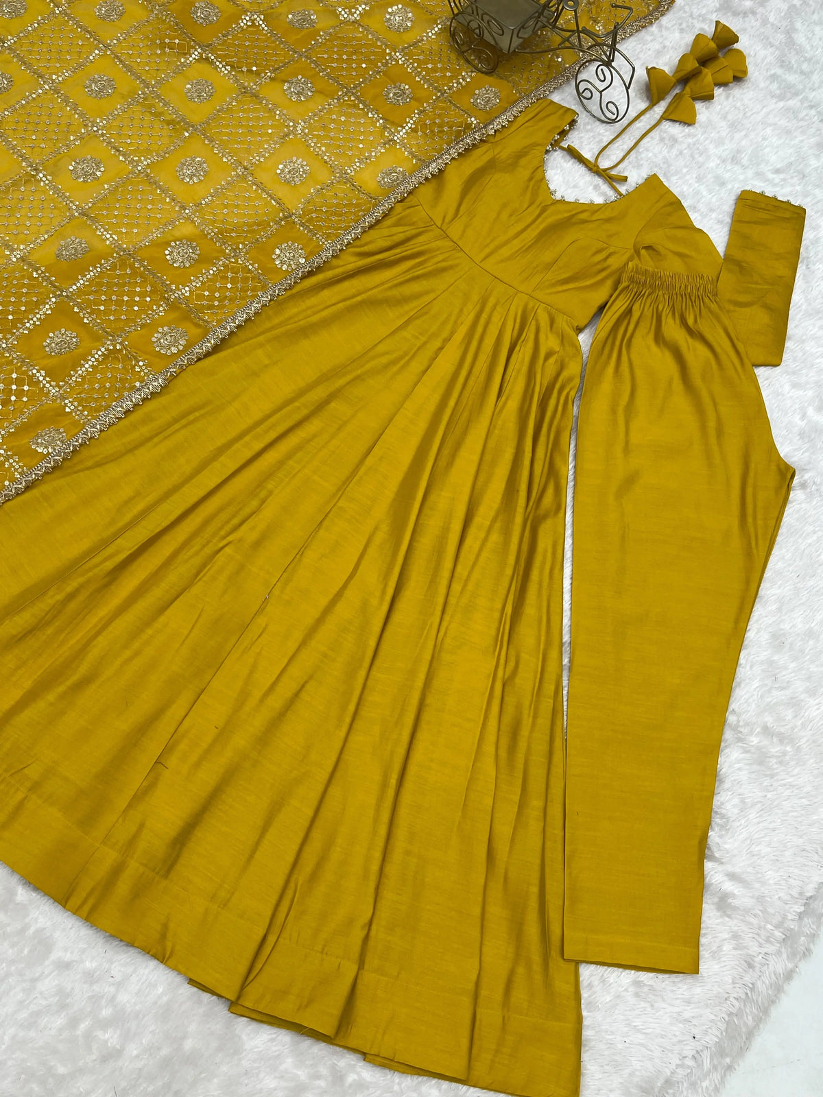 Flat lay of complete Yellow Sequins Embroidered Anarkali Suit set with pant and dupatta