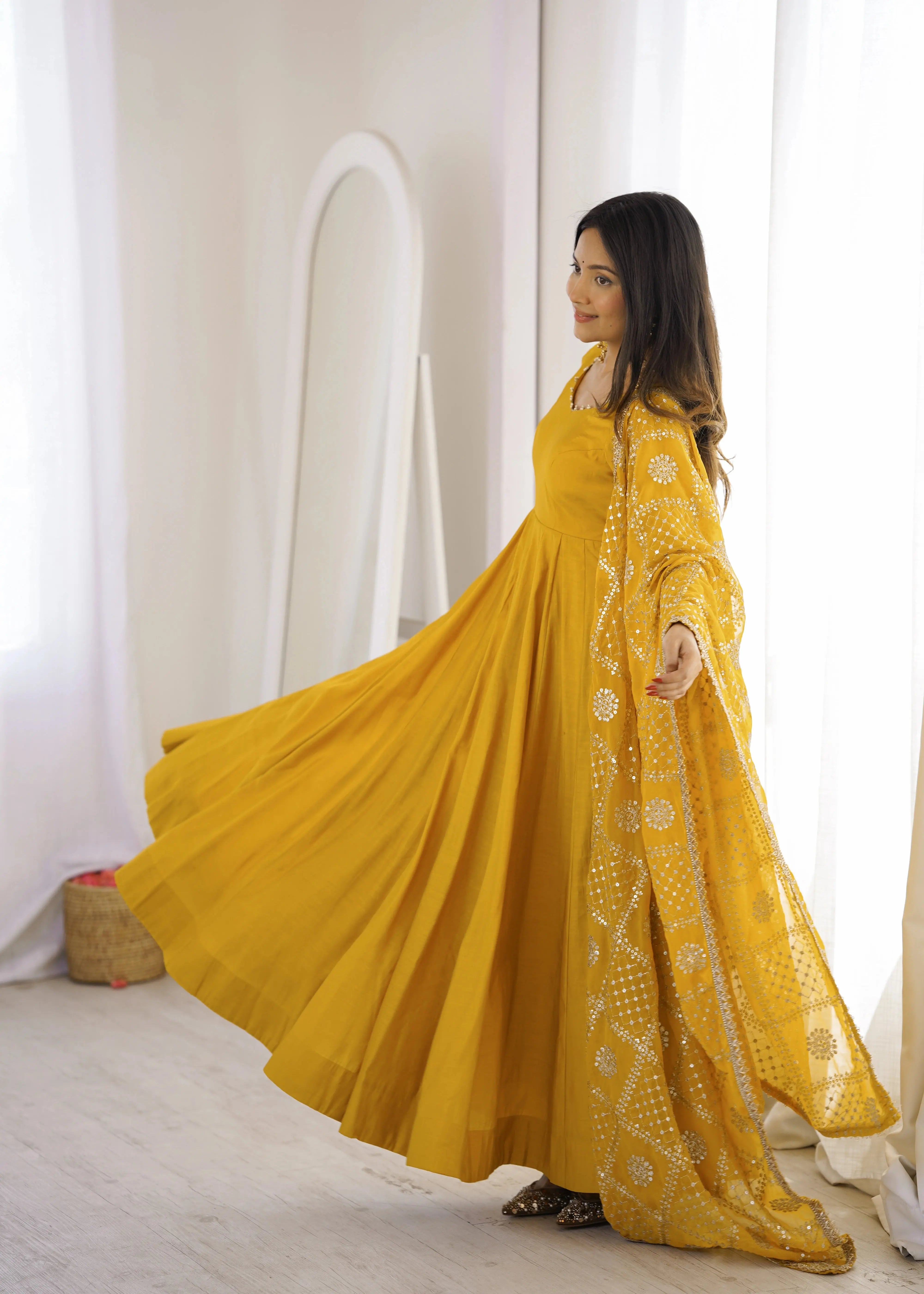 Yellow Sequins Embroidered Anarkali Suit side pose with dupatta flying
