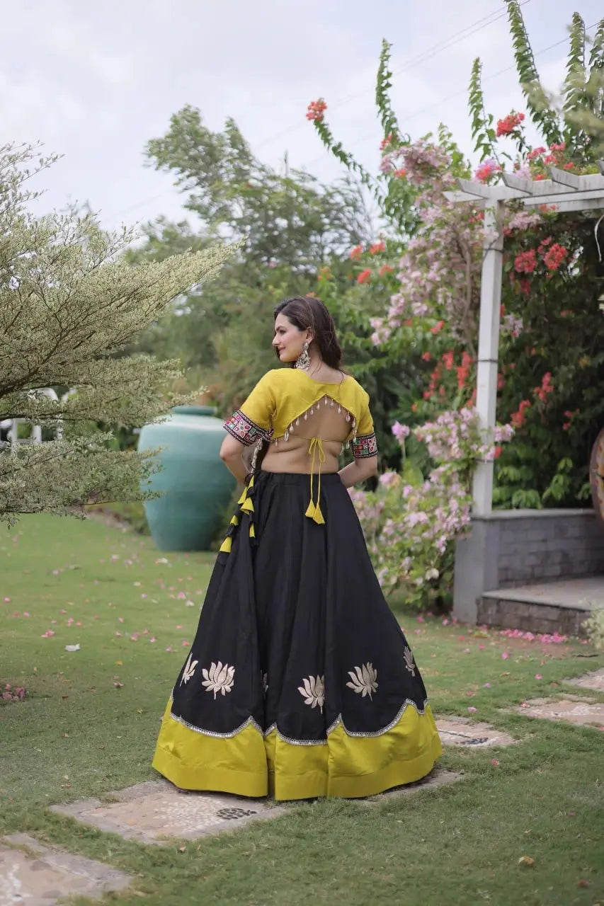 Stunning Black and Mustard Yellow Lehenga Choli with Vibrant Kutchi Embroidery, Flowing Flared Skirt, and Festive Traditional Appeal