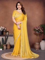 Woman wearing a yellow saree with a brown background