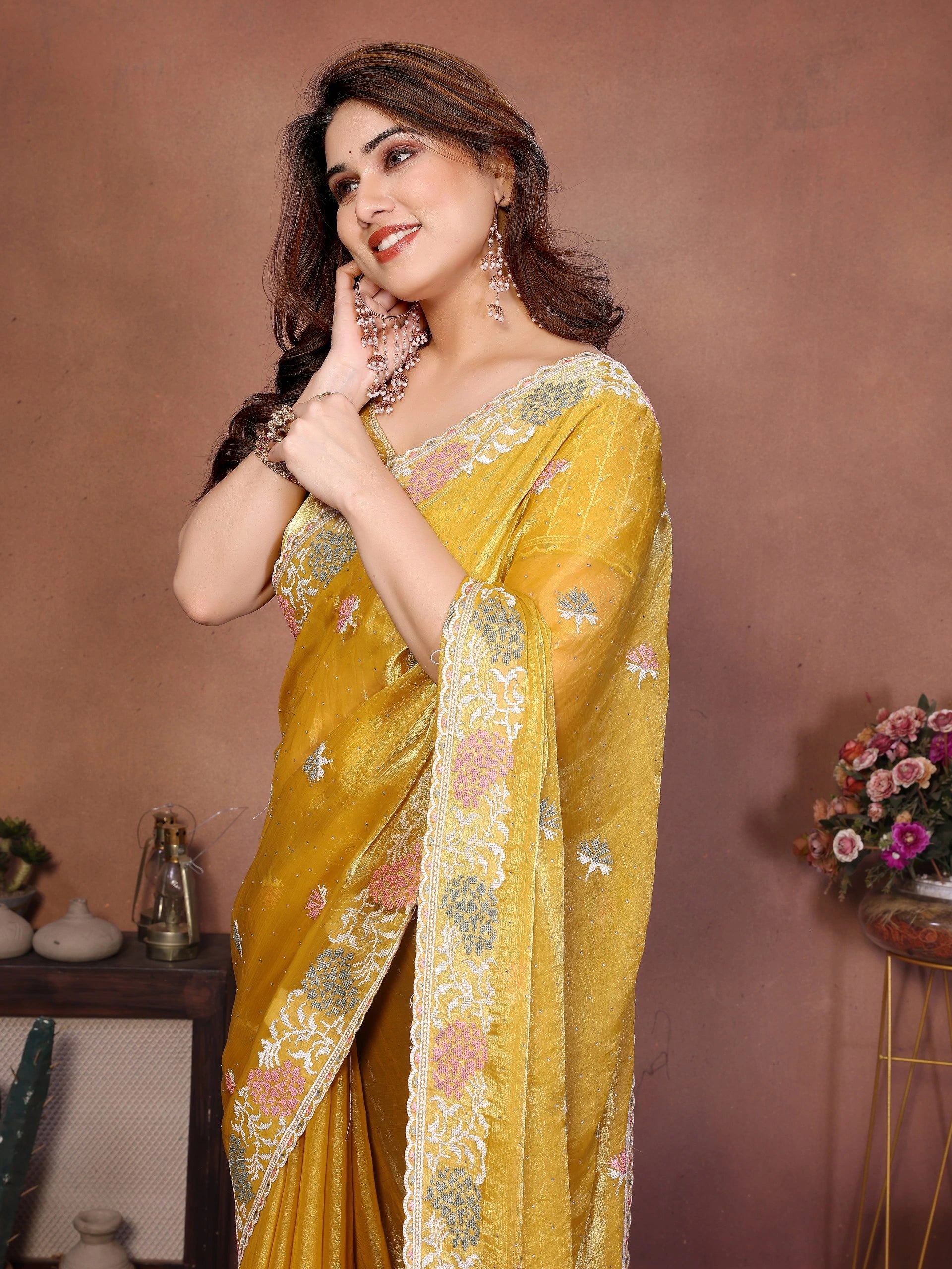 Yellow embroidered Swarovski work chiffon silk saree with navy blue Ikkat print, traditional zari border, and coordinating blouse piece — elegant drape for weddings and festive occasions