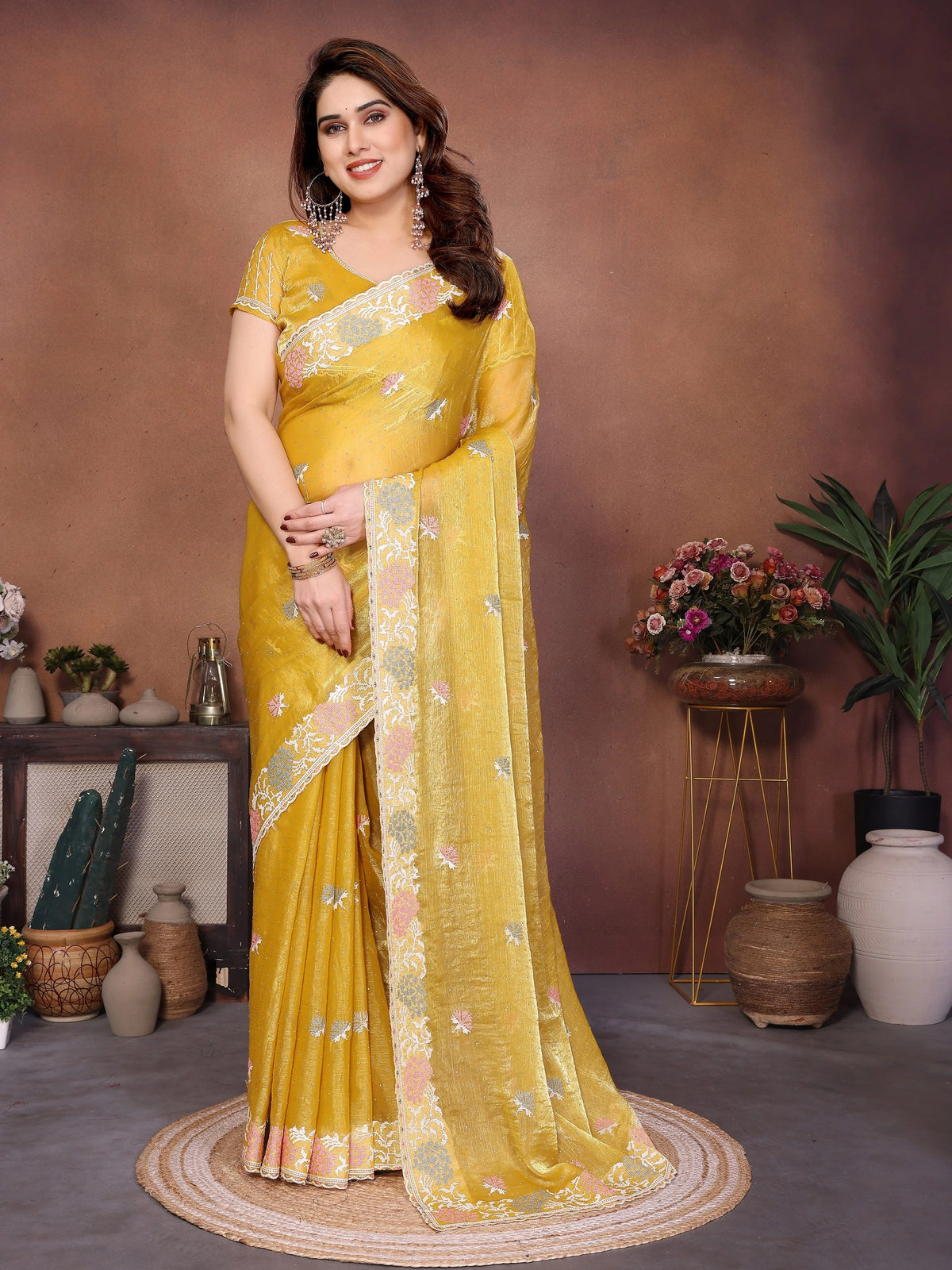 Yellow embroidered Swarovski work chiffon silk saree with navy blue Ikkat print, traditional zari border, and coordinating blouse piece — elegant drape for weddings and festive occasions