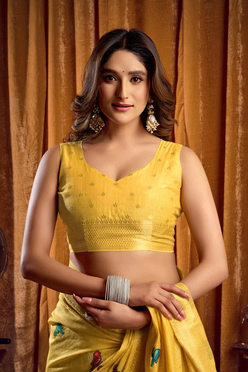 Woman wearing a yellow traditional outfit with a brown curtain background