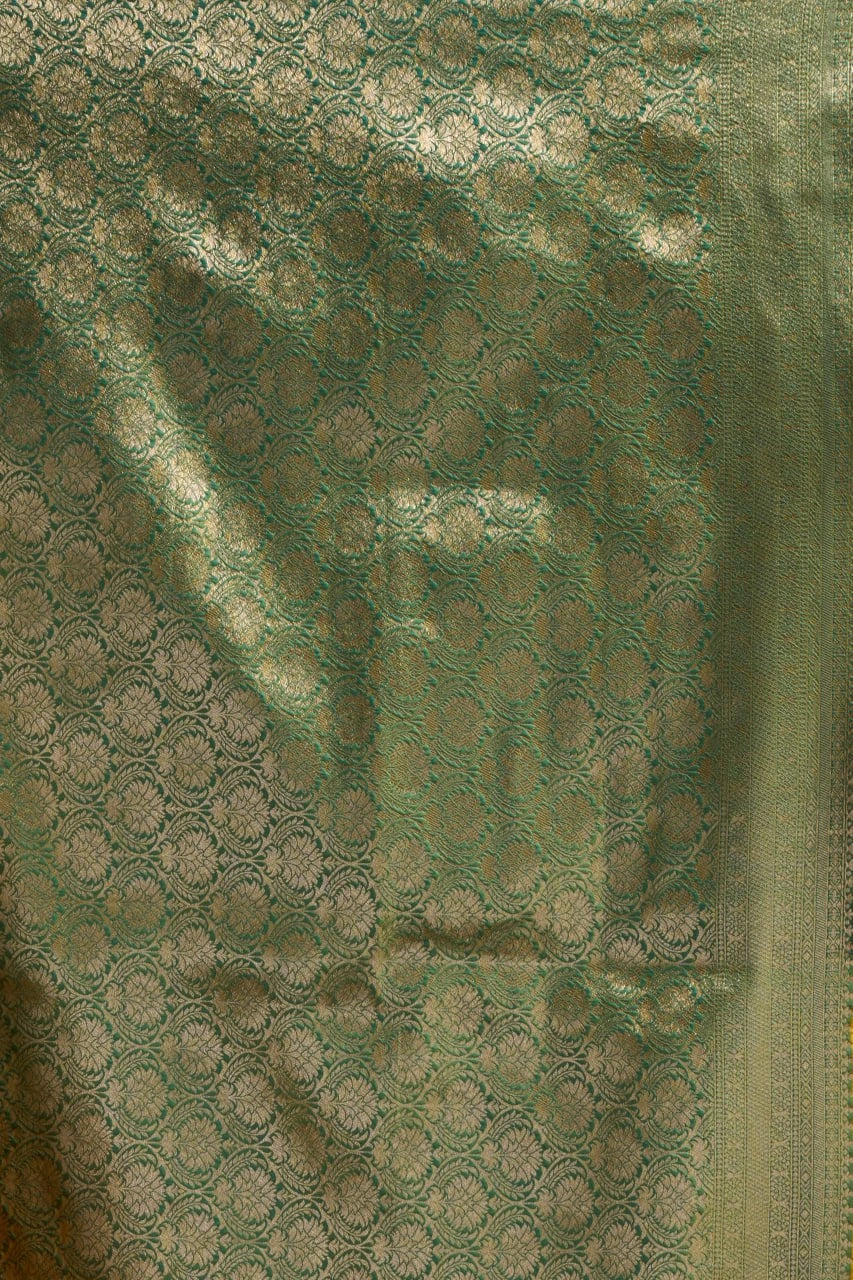 Close-up of green fabric with intricate patterns