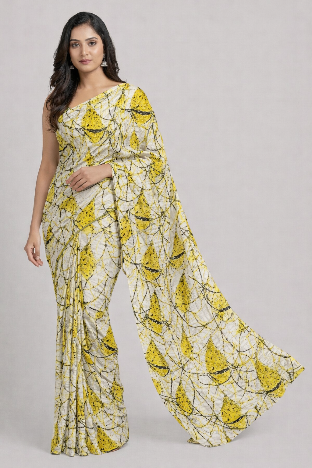 Woman wearing a yellow and white floral patterned outfit on a gray background